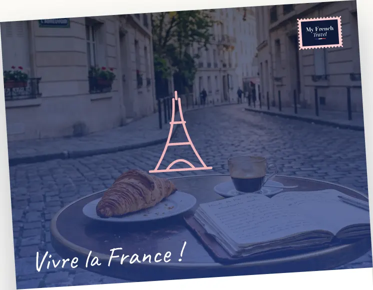 A croissant and coffee on a Paris café table — Vivre la France !